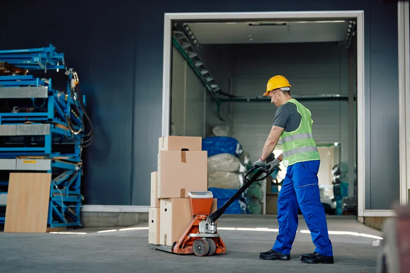 male-worker-pushing-packages-on-pallet-eurocruitment